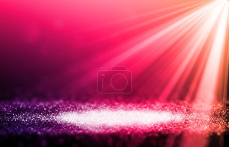 Téléchargez les photos : Pink sparkle rays glitter lights with spotlight bokeh elegant show on stage abstract background. Dust sparks background.Spotlight background - en image libre de droit