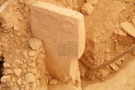 Pillar 43 in Enclosure D at the neolithic archaeological site of Gobekli Tepe, Potbelly Hill, a t-shaped pillar showing a bird, vulture, also called the Vulture Stone, close to Sanliurfa, Turkey 2022