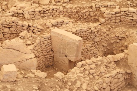 Pillar 12 in Enclosure C at the neolithic archaeological site of Gobekli Tepe, Potbelly Hill, a t-shaped pillar showing ducks and a boar, close to Sanliurfa, Turkey 2022