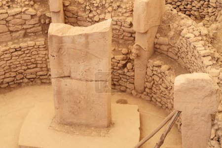Pillar 37, central pillar showing a fox and the pillar 27 with a cat chasing a boar in Enclosure C at the neolithic archaeological site of Gobekli Tepe, Potbelly Hill, close to Sanliurfa, Turkey 2022