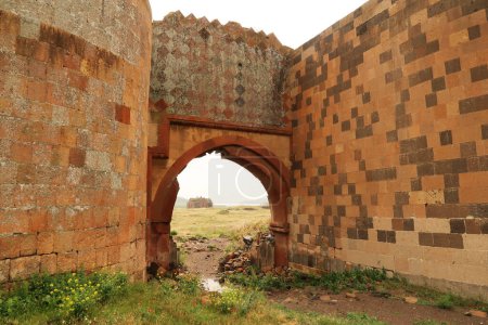 Photo for View through the Chequerboard, Chequer-board, chequer board Gate onto the Cathedral of Ani, Church of the Holy Mother of God at the ancient site of Ani, an abandoned ruined armenian city, close to Kars, Turkey 2022 - Royalty Free Image
