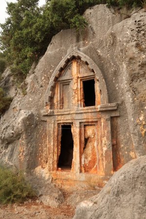 Ancient Lycian rock hewn, rock cut tomb above the coastal town of Kas, Turkey 2022