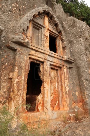 One of the ancient Lycian rock hewn, rock cut tombs above the coastal town of Kas, Turkey 2022