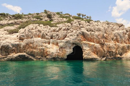 The fascinating Pirate Cave or Blue Cave on Asirli Island in the Gokkaya Bay close to Demre, Turkey 2022