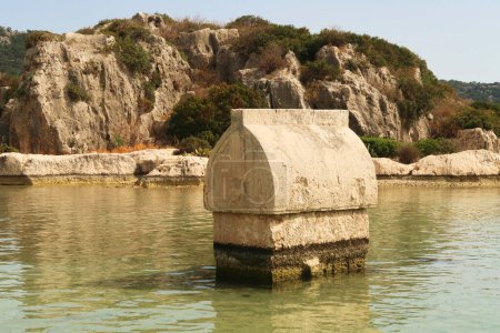 Lycian Sarcophagus in the shallow water close to the harbor of Kalekoy, close to Demre, Turkey 2022