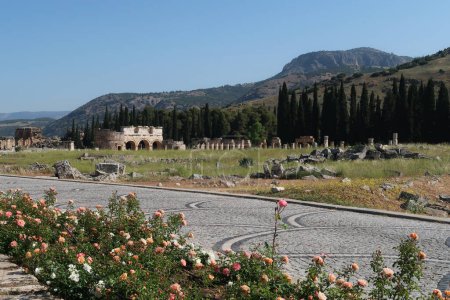 The ancient ruins of Hierapolis next to Pamukkale with the Domitian Gate and the Frontinus Street in the background, Denizli, Turkey 2022