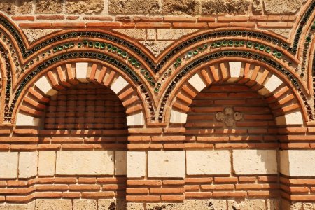 Patterns out of bricks and tiles decorate the elaborate facade of the Church of St., Saint Paraskevi, Sveta Paraskeva in the old town of Nessebar, Nesebar, Bulgaria 2022