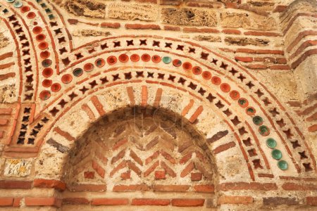 Elaborate patterns out of bricks and tiles decorate the facade of the Church of St., Saint Paraskevi, Sveta Paraskeva in the old town of Nessebar, Nesebar, Bulgaria 2022