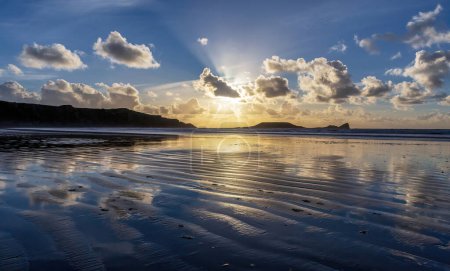 Evening at Rhossili Bay and Worms head on the Gower Peninsula in South Wales U