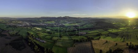 Photo for Panoramic view of a sunset over the Brecon Beacons looking towards the highest peaks of Penyfan and Corn Du in South Wales U - Royalty Free Image
