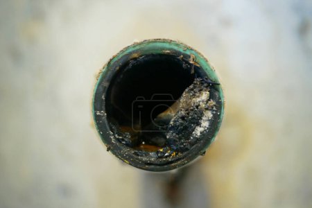 Sewer wash-basin cleaning sink sewage kitchen blockage pipe drain cleaning and septic cesspool pumping siphon into wash leak basin tank by suction hose under high pressure. The sump flowing contains