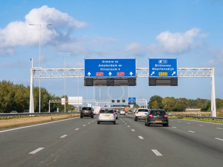 Photo for UTRECHT, NETHERLANDS - OCT 15, 2021: Traffic and route information on overhead gantry, motorway A27 between Utrecht and Hilversum - Royalty Free Image