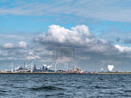 Photo for IJMUIDEN, NETHERLANDS - AUG 20, 2021: Steel industry Tata steel blast furnaces in harbour - Royalty Free Image