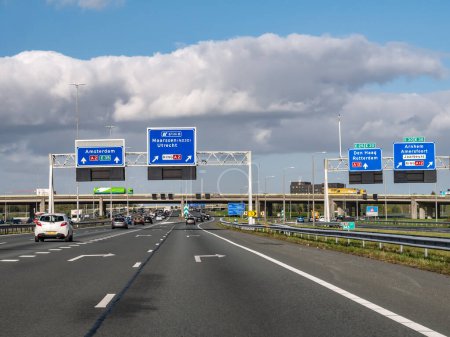 Photo for UTRECHT, NETHERLANDS - OCT 15, 2021: Direction information on overhead gantries, orbital motorway A2 traffic junction Oudenrijn - Royalty Free Image