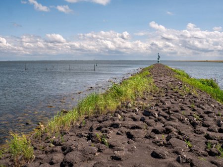Breakwater between IJsselmeer lake en Trintelhaven harbour along Houtribdijk near Lelystad, Netherlands