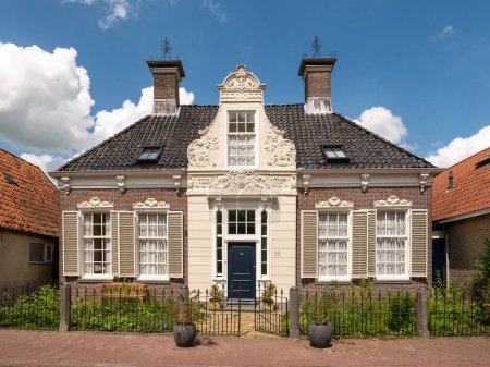 Photo for HEEG, NETHERLANDS - JUL 6, 2023: Front view of former hooischippershuis, hay skippers house, in center of Heeg, Friesland, Netherlands - Royalty Free Image