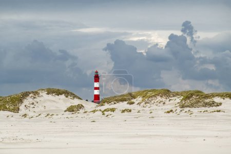 Photo for Lighthouse and Kniepsand beach near Wittdun on Amrum island, North Frisia, Schleswig-Holstein, Germany - Royalty Free Image