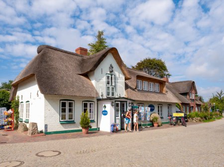 Photo for Amrum, Germany - Aug 25, 2023: Street with giftshop in old town of Nebel, Amrum island, North Frisia, Schleswig-Holstein - Royalty Free Image