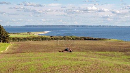 Photo for Autumn view of west coast cliffs, coastline and covered hills on Livo island, Limfjord, Nordjylland, Denmark - Royalty Free Image