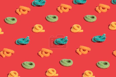 Foto de Gummy candies on red background - Imagen libre de derechos