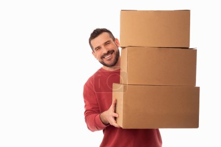 Photo for Smiling bearded man on white background holding large cardboard boxes. Delivery of packages. Home improvements. Organization of personal belongings - Royalty Free Image