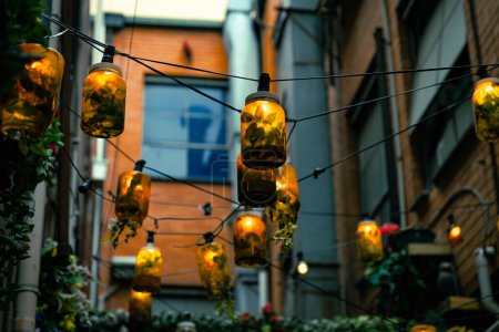 Urban Jar Lights glowing in an alley