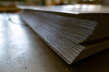 Photo for A stack of galvanized thin hot rolled steel sheets in a warehouse - Royalty Free Image