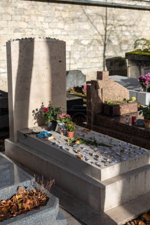 Photo for A grave of Jean-Paul Sartre and Simone de Beauvoir on Montparnasse Cemetery, Paris, France. A famous couple, was of the most influential and controversial writers and thinkers of the 20th century - Royalty Free Image