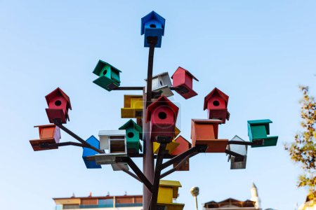 Colorful birdhouses on a creative tree
