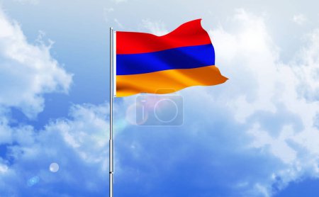 The flag of Armenia waving on the shiny blue sky