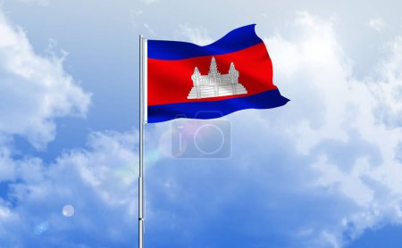 The flag of Cambodia waving on the shiny blue sky