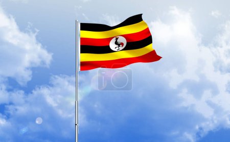The flag of Uganda waving on the shiny blue sky