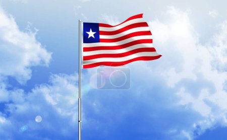 The flag of Liberia waving on the shiny blue sky