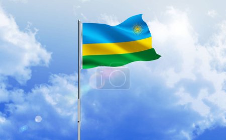The flag of Rwanda waving on the shiny blue sky