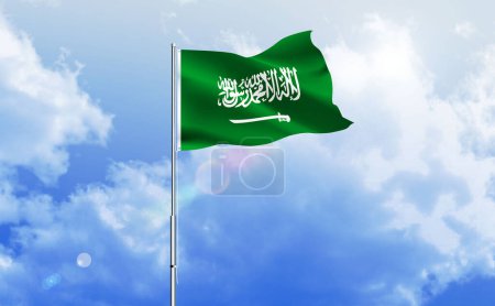The flag of Saudi Arabia waving on the shiny blue sky