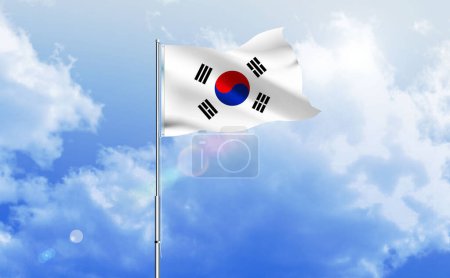The flag of South Korea waving on the shiny blue sky