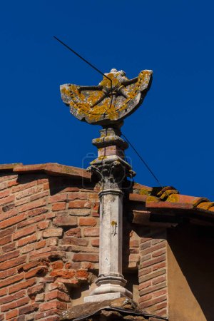 Photo for Ancient times and hours. Old sundial with gnomon on Ponte Vecchio (Old Bridge) in Florence - Royalty Free Image