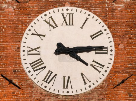 Photo for Time and hours. Old clock with roman numbers - Royalty Free Image