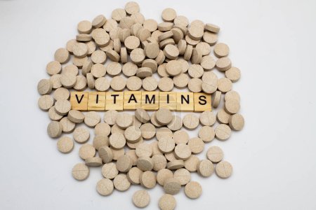 Photo for Multivitamin tablets on white - Royalty Free Image
