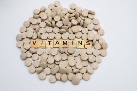 Photo for Multivitamin tablets on white - Royalty Free Image