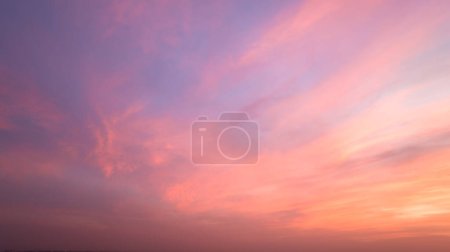Twilight sky with effect of light pastel tone. Colorful sunset of soft clouds for background abstrac concept, aerial view 