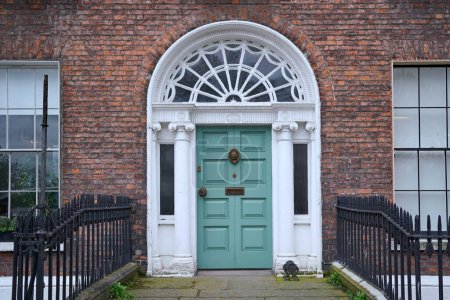 Photo for Georgian style architecture, front door of townhouse used as residence or offices - Royalty Free Image