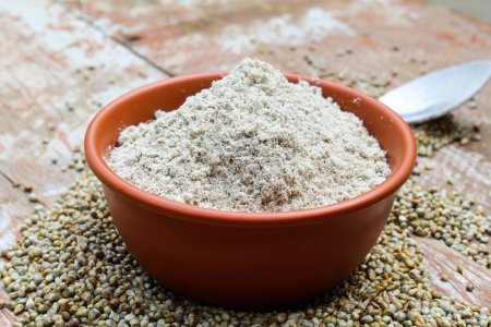 Pearl millet powder in a bowl close-up view 