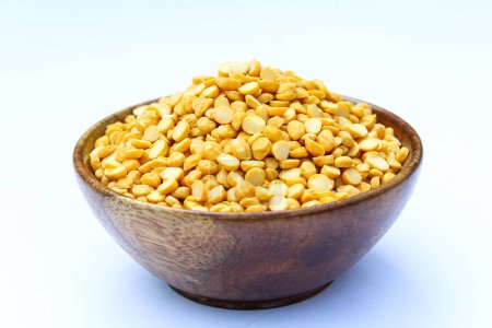 Split chickpeas or chana dal in a wooden bowl 