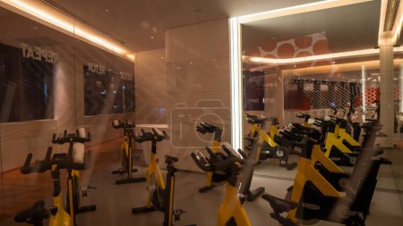 Photo for Background image of various exercise machines in workout hall of modern gym interior. High quality photo - Royalty Free Image