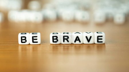 Photo for Be brave slogan in white block letter beads . High quality photo - Royalty Free Image