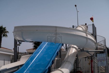 Inflatable water slides provide aquatic fun at a water park. Amusement park attractions, ideal for children's parties, events, and team-building corporate gatherings. Entertainment equipment for vario