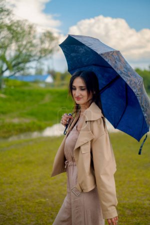 Woman under summer rain, holding umbrella, weather forecast and rainy atmosphere.