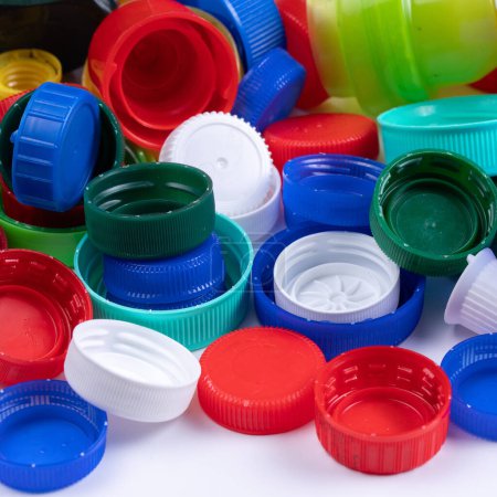 A vibrant collection of various plastic bottle caps, emphasizing the importance of recycling to protect the environment