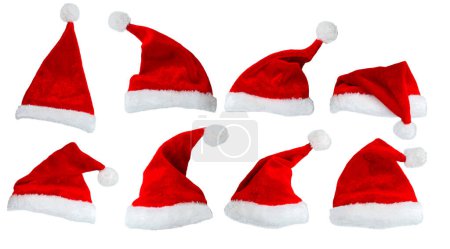 Foto de Colección de Santa Claus sombrero o gorra roja de Navidad con aislado sobre fondo blanco. Concepto vacaciones tema. - Imagen libre de derechos